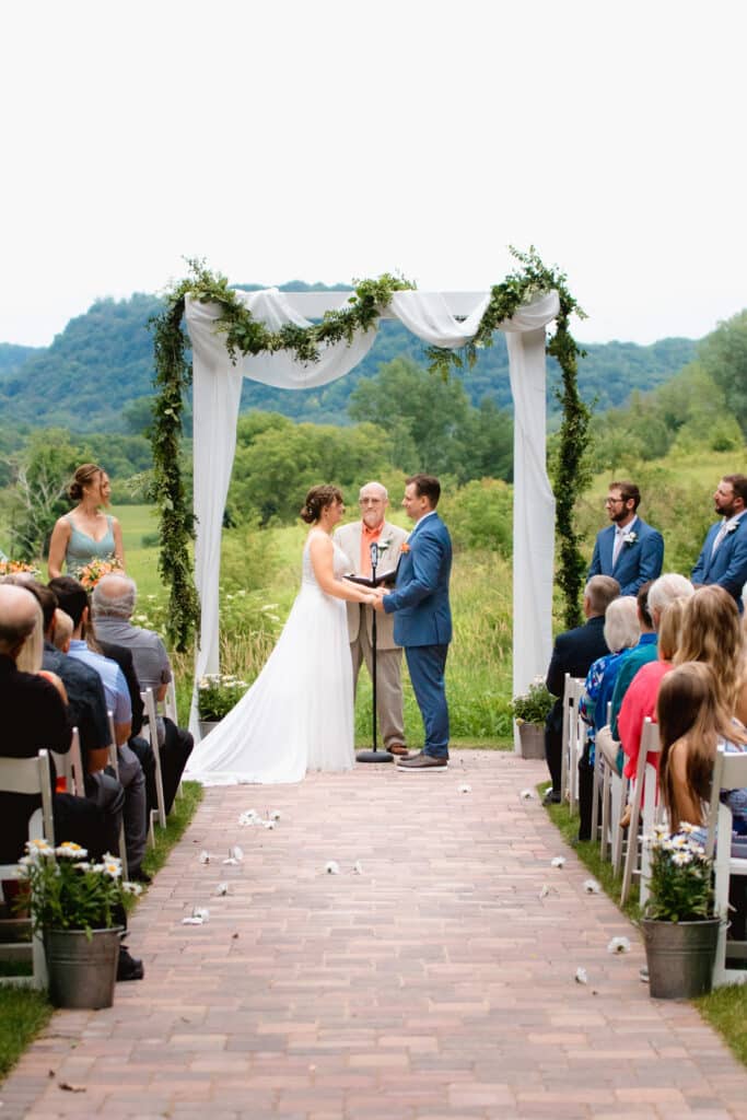 Ceremony at the round barn Farm Wedding Venue in Red Wing Minnesota. Minnesota Wedding venues can have the best views and scenery in southeast Minnesota.