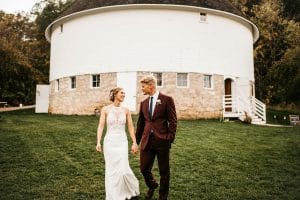 Wedding photo outside the barn venue at Round Barn Farm, one of the leading Minnesota wedding venues in Red Wing, MN