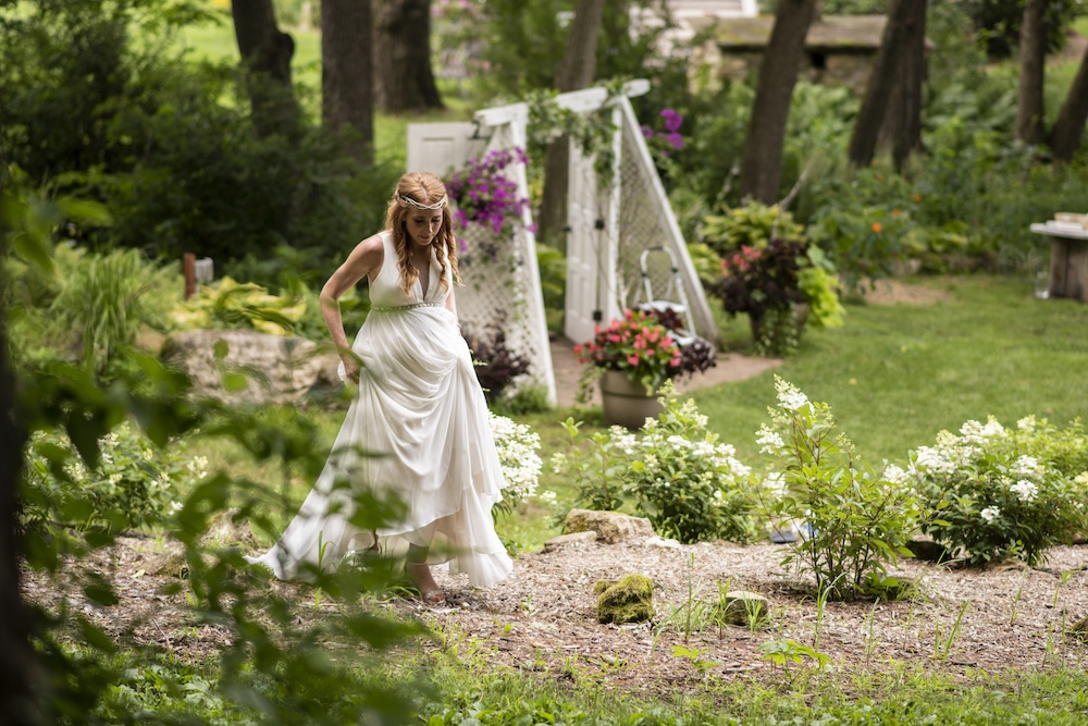 Bride in the garden at one of the best MN Wedding venues