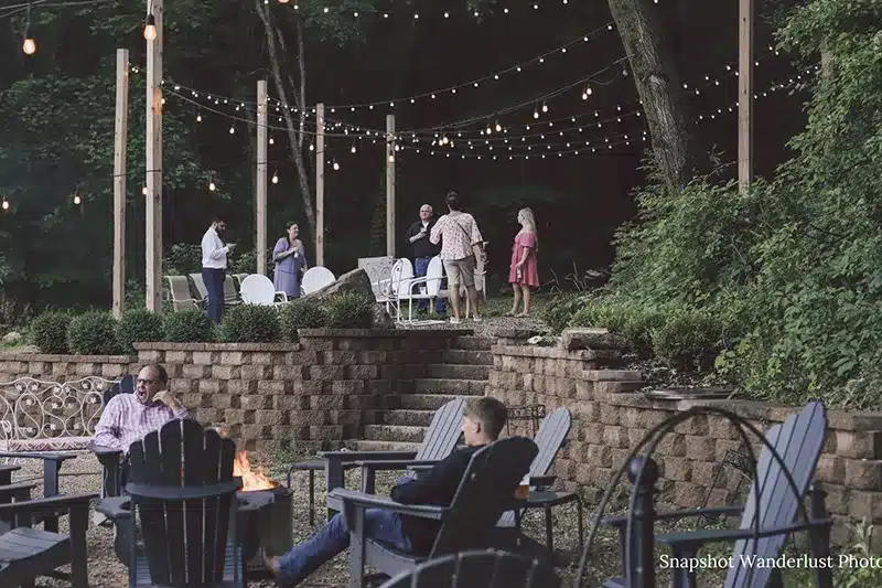 Wedding guests enjoying the bonfire at a Wedding venue in MN in Red Wing.