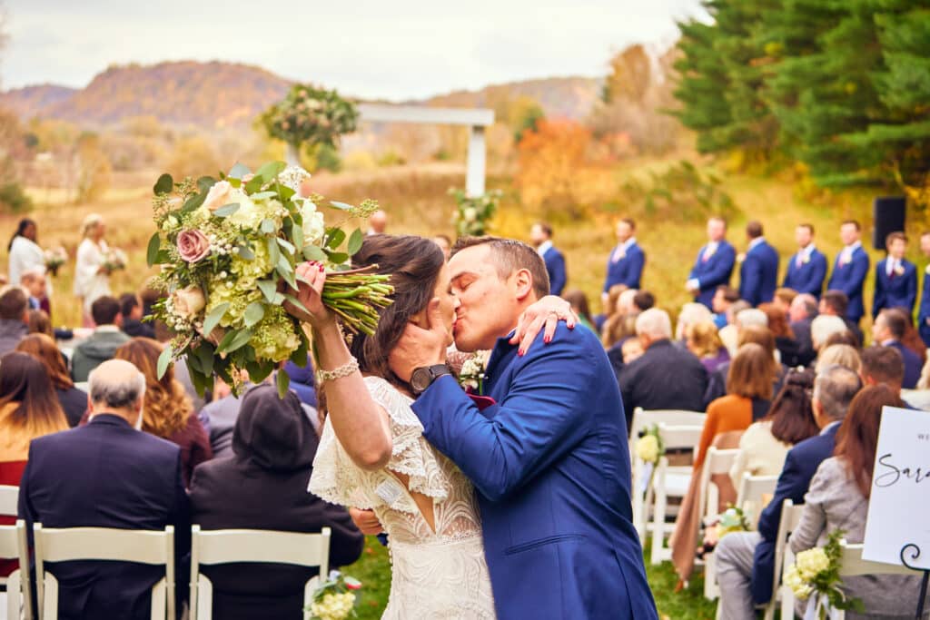Fall Wedding Inspiration for the Best Minnesota Wedding Venues 4 Bride and Groom kiss after their fall wedding at our Minnesota Wedding Venue.