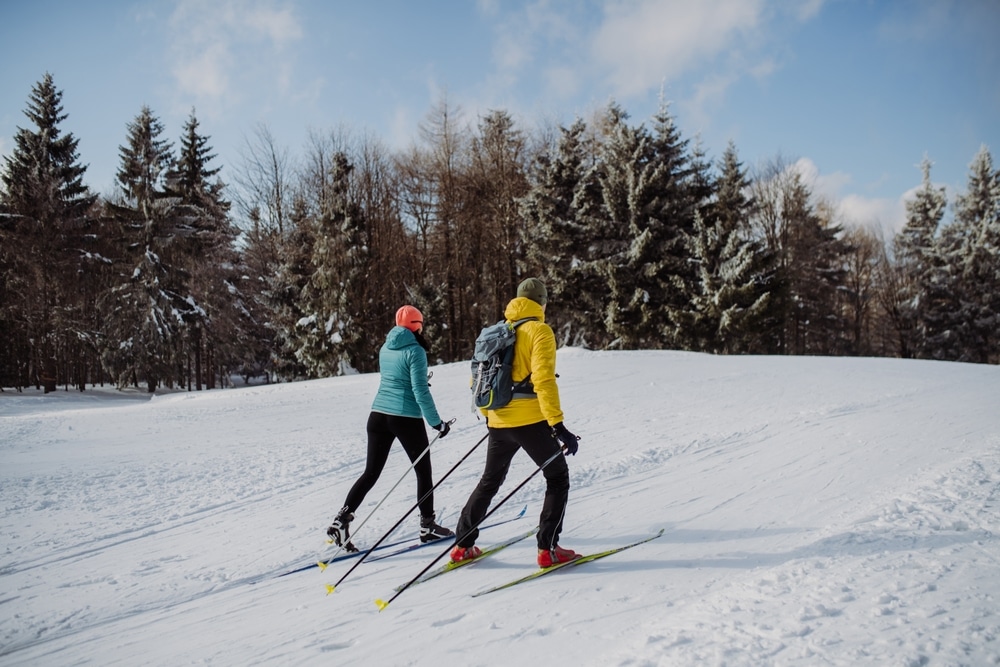 Couple cross country skiing in Frontenac State Park.