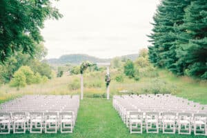 Outdoor wedding ceremony area set up with arch and chairs at our Southern Minnesota wedding venues.
